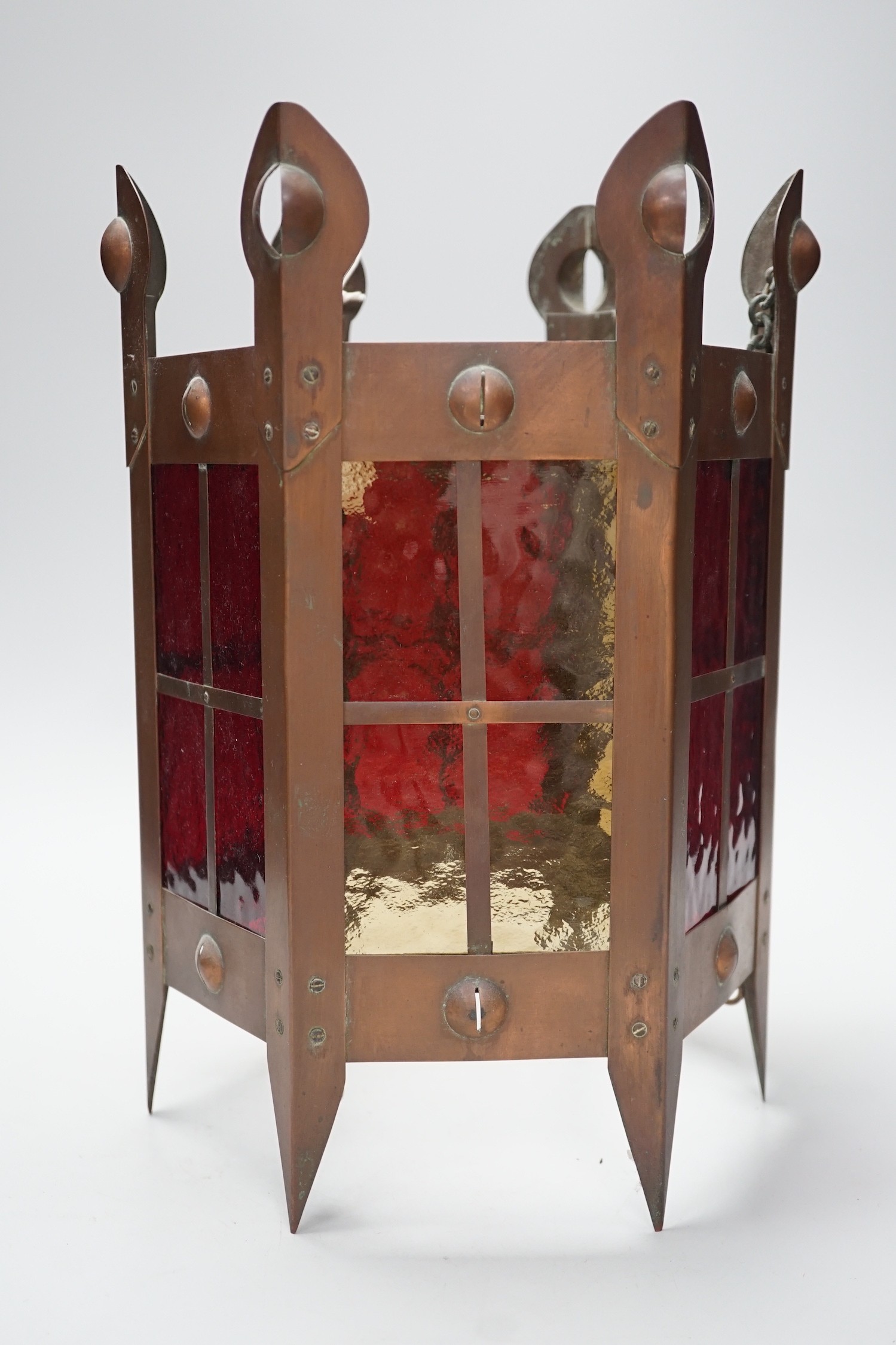 An Arts & Crafts copper and coloured glass hall lantern, 35cm